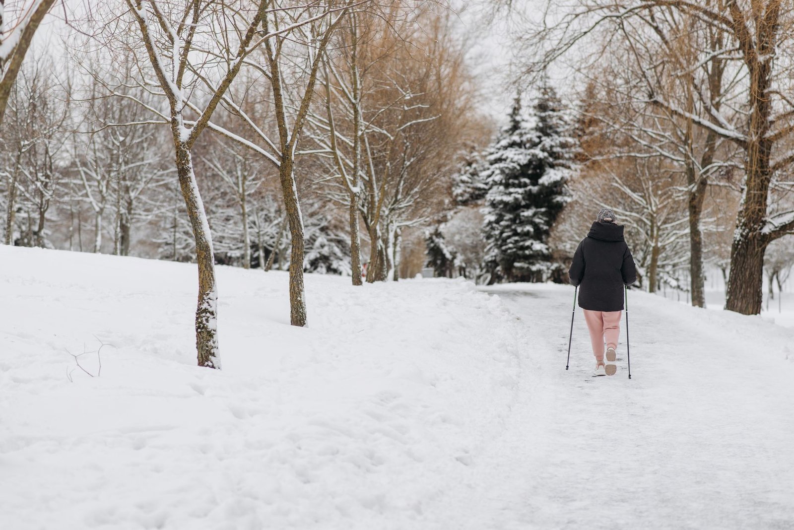 Winter arc walk on a snowy path in daylight